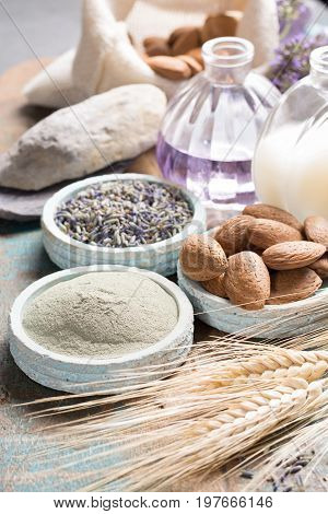Nature cosmetics handmade preparation with essential oils and ancient minerals of parfums skincare creams soaps from fresh and dried lavender flowers wheat almond nuts green clay powder in French artisanal boutique home style