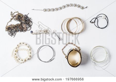 Fashion Women's Jewelry On A White Concrete Background