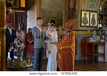 Alchevsk, Ukraine - April 28, 2017: Wedding Ceremony For Newlyweds In The Church