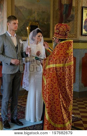Alchevsk, Ukraine - April 28, 2017: Wedding Ceremony For Newlyweds In The Church
