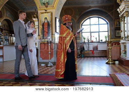 Alchevsk, Ukraine - April 28, 2017: Wedding Ceremony For Newlyweds In The Church