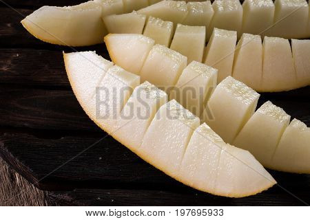 Fresh Sweet Orange Melon On The Wooden Table, Selective Focus And Toned Image