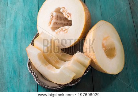 Fresh Sweet Orange Melon On The Wooden Table, Selective Focus And Toned Image