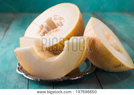 Fresh Sweet Orange Melon On The Wooden Table, Selective Focus And Toned Image