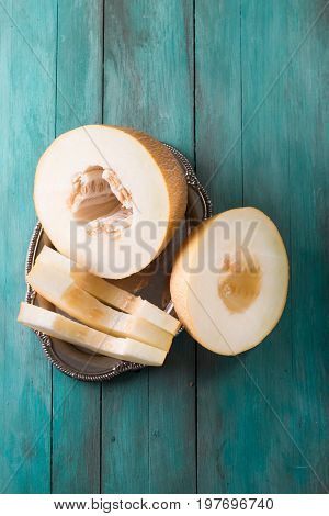 Fresh Sweet Orange Melon On The Wooden Table, Selective Focus And Toned Image
