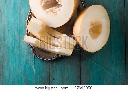 Fresh Sweet Orange Melon On The Wooden Table, Selective Focus And Toned Image