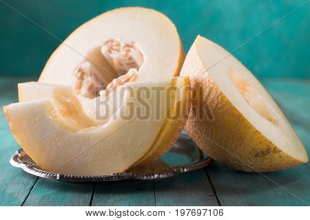 Fresh Sweet Orange Melon On The Wooden Table, Selective Focus And Toned Image