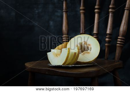 Fresh Sweet Orange Melon On The Wooden Table, Selective Focus And Toned Image