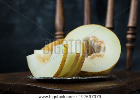 Fresh Sweet Orange Melon On The Wooden Table, Selective Focus And Toned Image