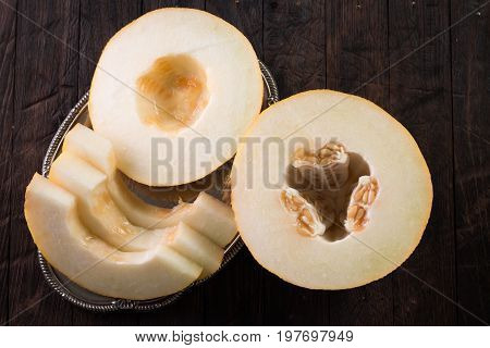 Fresh Sweet Orange Melon On The Wooden Table, Selective Focus And Toned Image