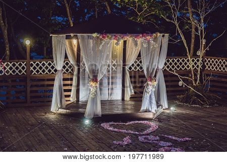 Night Wedding Ceremony. Decorations For Wedding Ceremony Arch And Lamps In The Night Forest