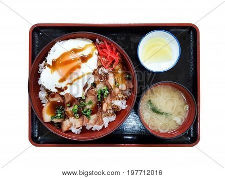 Japan Rice with Roasted pork , Fried Egg , Soup and radish isolated top view