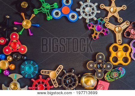 A Lot Of Different Spinners On A Black Background