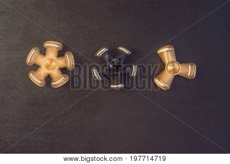 Famous Fidget Spinner Stress Relieving N A Black Wooden Background