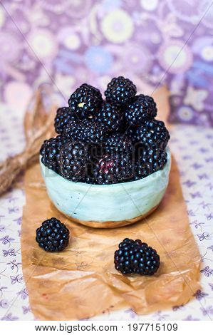 Homemade, sweet, delicious blackberries in a handmade dish