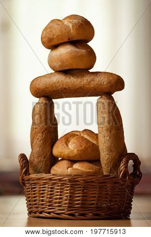 Various types of bread put together to form a tower