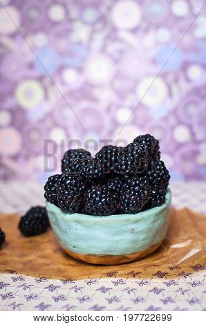 Homemade, sweet, delicious blackberries in a handmade dish
