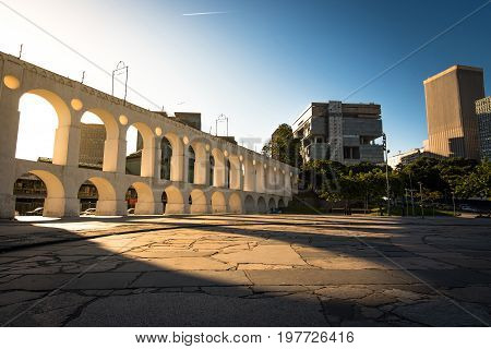 Beautiful View of Sun Shining Through Landmark Lapa Arch in Rio de Janeiro City Downtown.
