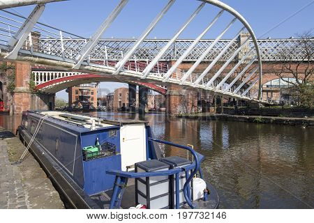 View of Castlefield Basin & the Merchant's Bridge with the historical rail bridge and Potato Wharf in the background