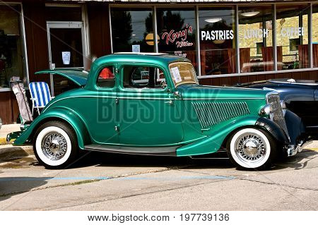 CASSELTON, NORTH DAKOTA, July 27, 2017: The annual Casselton Car Show which occurs the last Thursday of July features classic vehicles such as the  restored Ford Coupe with 5 windows.
