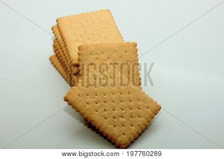 Stacked plain bisuits on a white background
