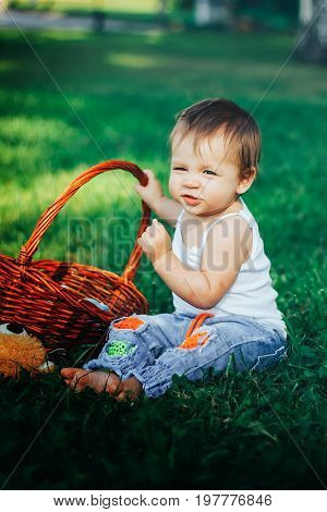 Quite extraordinary funny portrait of baby holding basket