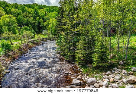 Saint Lawrence river with inland creek in Saint-Irenee Quebec Canada in Charlevoix region