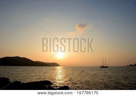 Lonely yacht in the sea sunset background