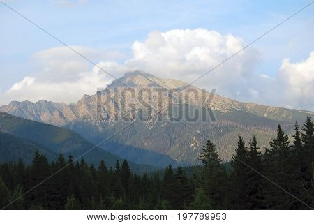 evening Krivan peakt with blue sky and few clouds in High Tatras mountains. from Podbanske in Slovakia