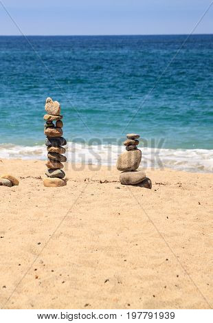 Stones Piled On Top Of One Another In Inuksuk Fashion