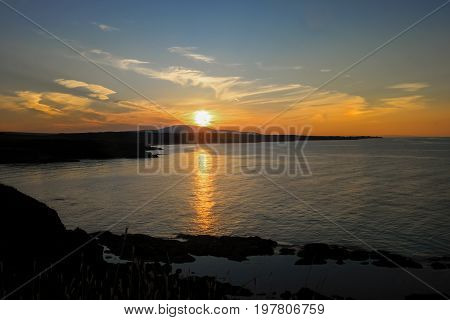 Dramatic sunset landscape with clouds on the beach Sinemorets Bulgaria