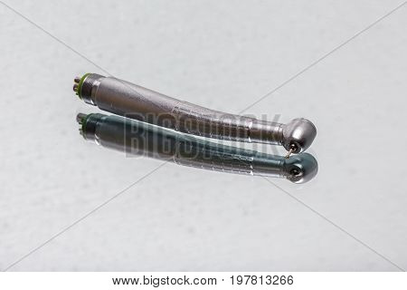 dental and endodontic instruments on the mirror. Top view