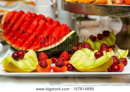 Heap of fresh fruits and vegetables on table close up.