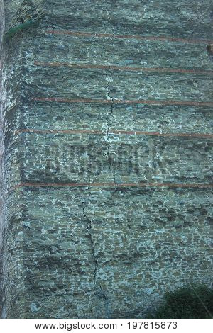 Stone pavement texture. Granite cobblestoned background at sunny day