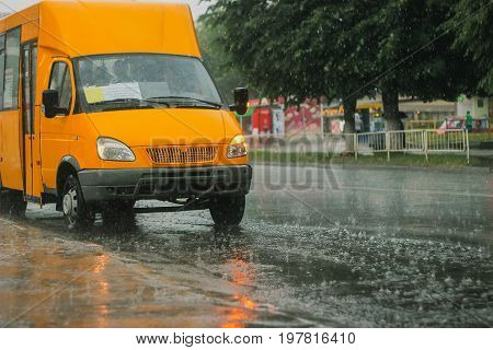 blurred bus running on the road in raining day.