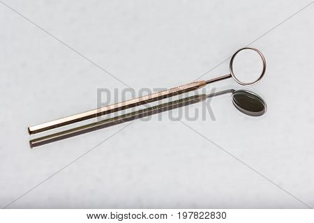 dental and endodontic instruments on the mirror. Top view