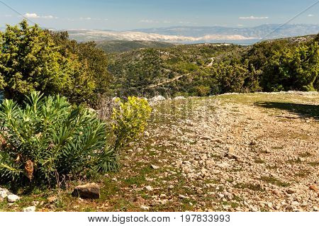 Ancient roman road near Merag with view over Krk