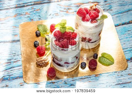 Healthy Breakfast - Dessert With Yogurt, Granola, Outs Flakes, Jam, Raspberries, Blueberries, Hazeln