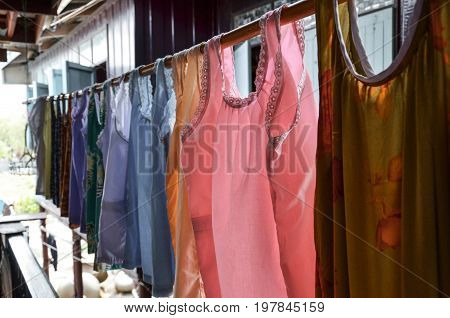 Colorful Thai Traditional Clothes Hanging on the rail