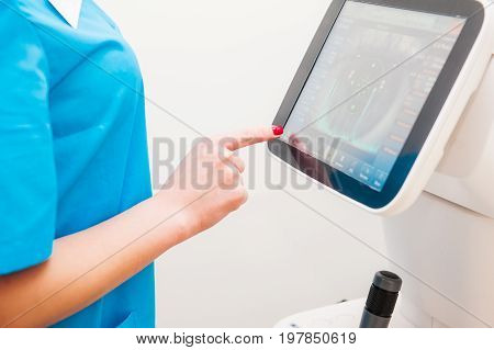 Doctor Controls Instrument Exploring Patients Eye In Ophthalmology Clinic, Auto-ref-keratometer. Clo