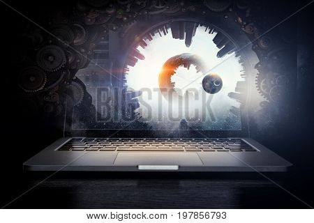 Laptop and construction concept. Mixed media