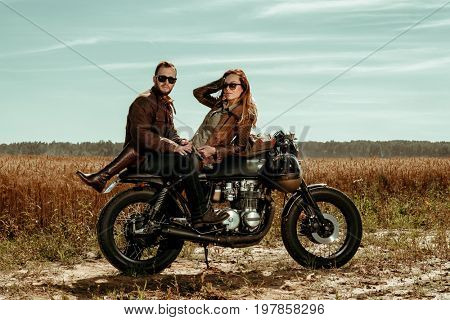 Couple and cafe racer motorcycle