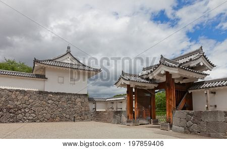YAMAGATA JAPAN - MAY 28 2017: Reconstructed (1991) Outer Eastern Main Gate and Tamon Turret of Second Bailey of Yamagata Castle (founded in 1356). National historical site of Japan since 1986