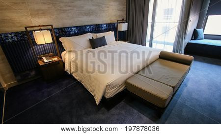 Clean hotel room with wooden bunk beds. Vintage effect style pictures.
