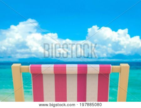 beach chiar with blurred sea and blue sky as background.