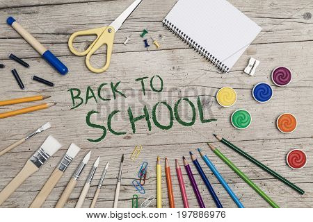 School Accessories On A Wooden Background