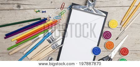 School Accessories On A Wooden Background