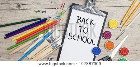 School Accessories On A Wooden Background