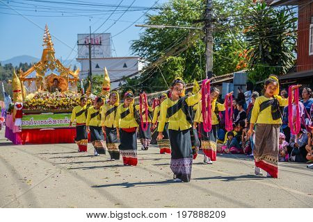 CHIANGMAI THAILAND - JANUARY 25 2015: Indigenous little girls with traditional costume dancing in traditional style in parade of 22nd Traditional Skirt Fabric and The Indigenous Product and Culture Festival in Mae Chaem Chiangmai Thailand