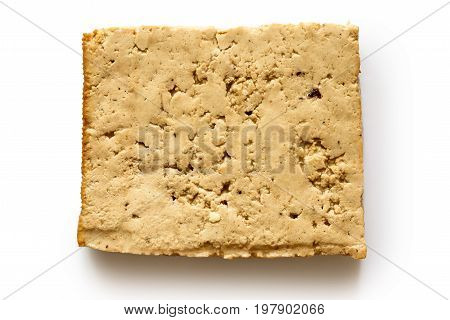 Single Block Of Lightly Smoked Tofu Isolated On White From Above.